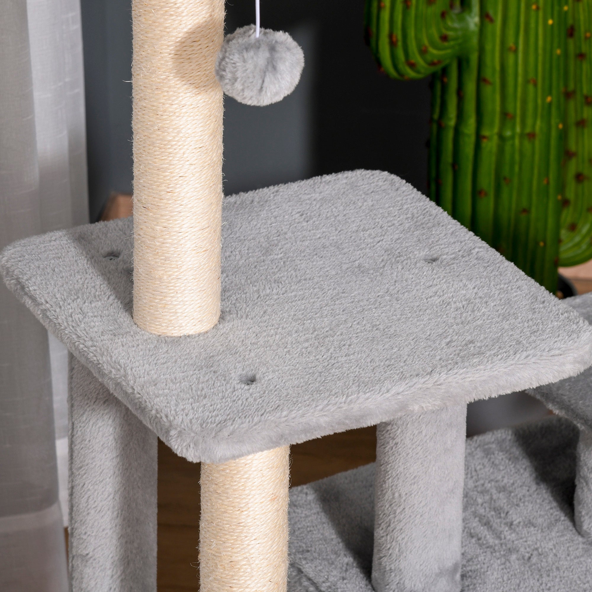 Gray pawhut cat tree tower with sisal scratching posts, hanging gray pom-pom toy, and perch size for indoor cats