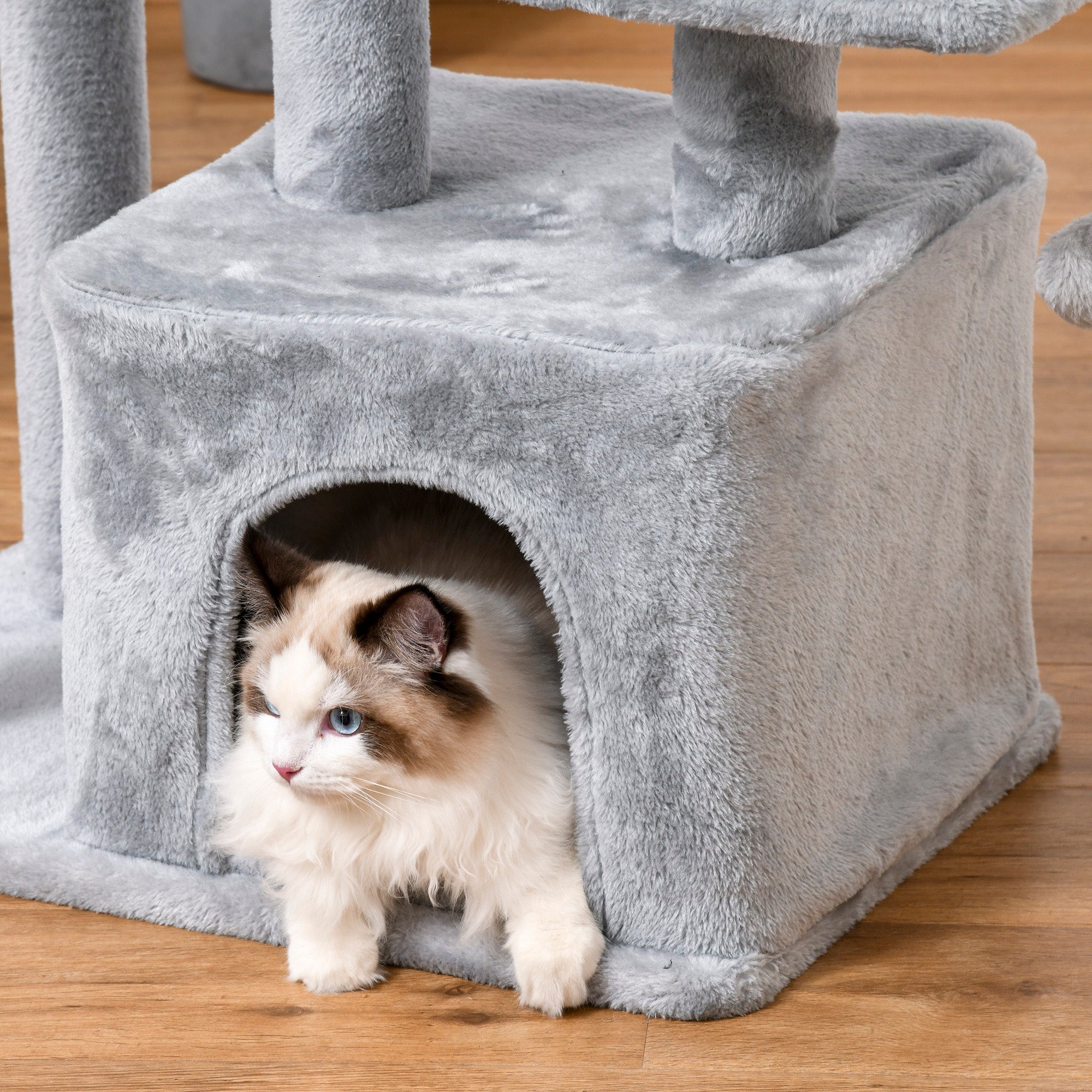 Gray plush pawhut cat tree house with sisal scratching posts and perch size, fluffy cat peeking out the entrance