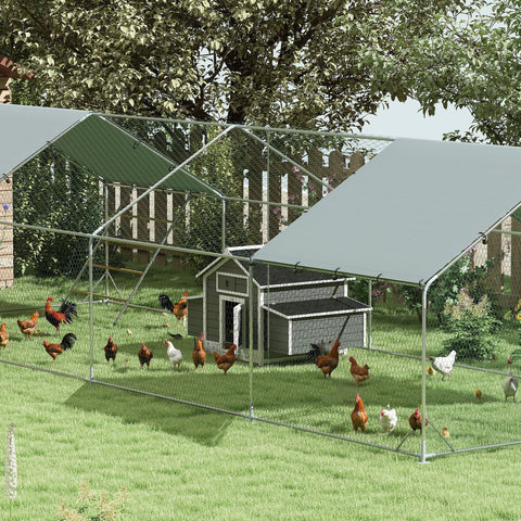 Gray metal pawhut chicken coop with black roof white trim wire mesh fence and green tarps for outdoor hen housing