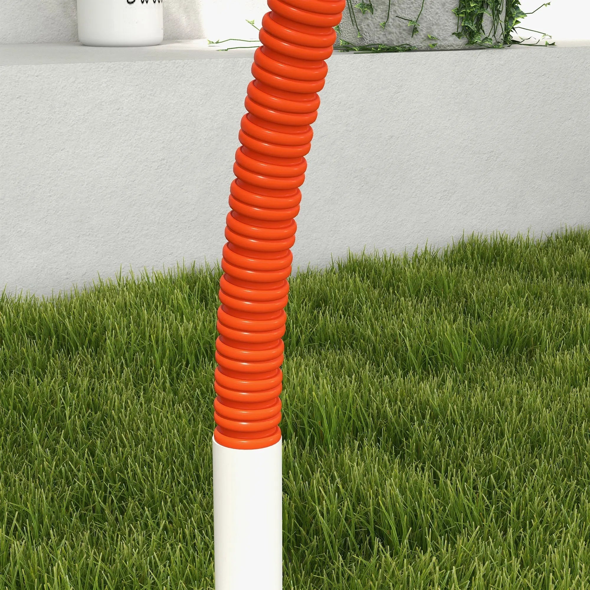 Orange corrugated plastic weave pole with white base standing in grass from pawhut dog agility set with oxford carry bag