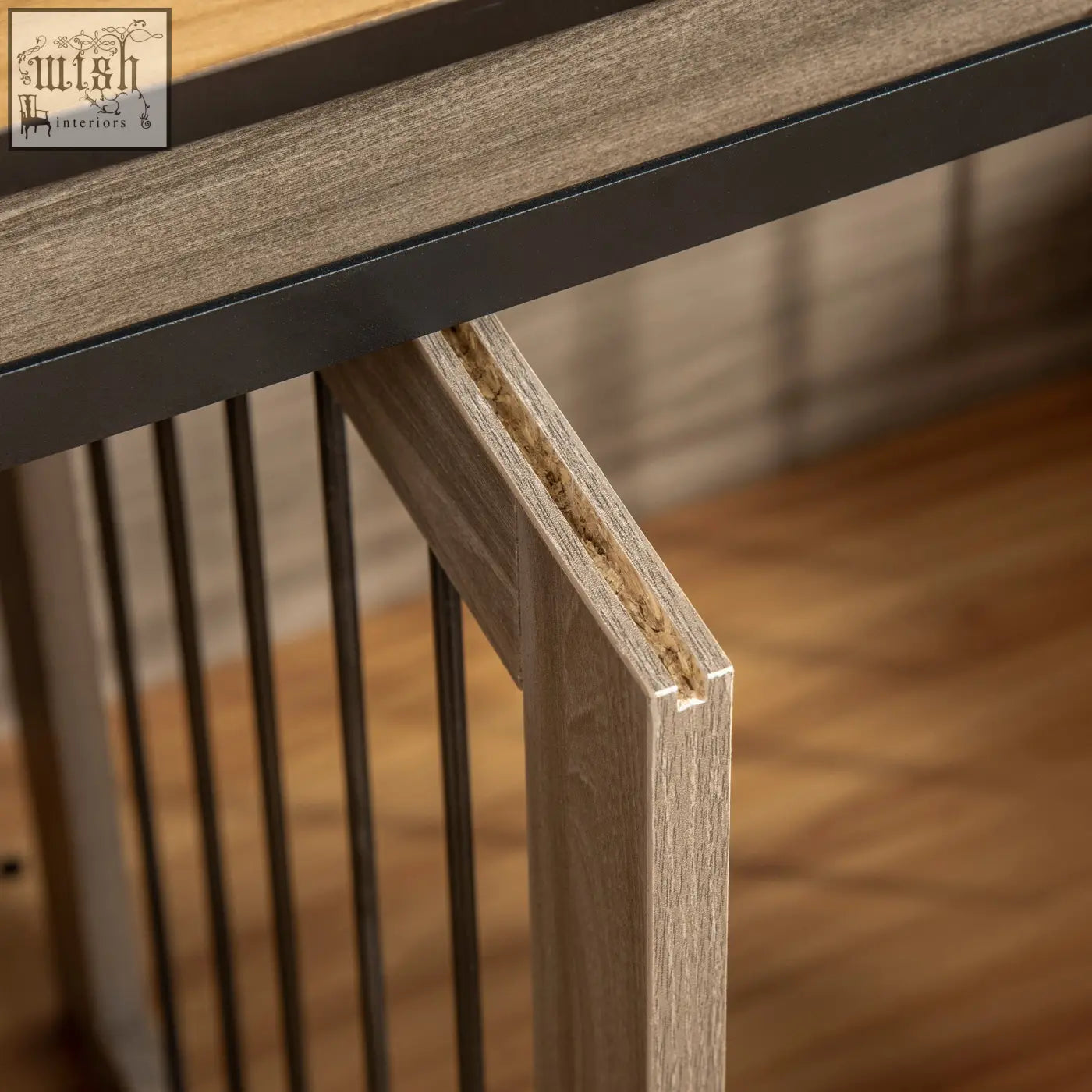 Gray wood grain tabletop with black metal frame and vertical slats on pawhut dog cage for two small dogs