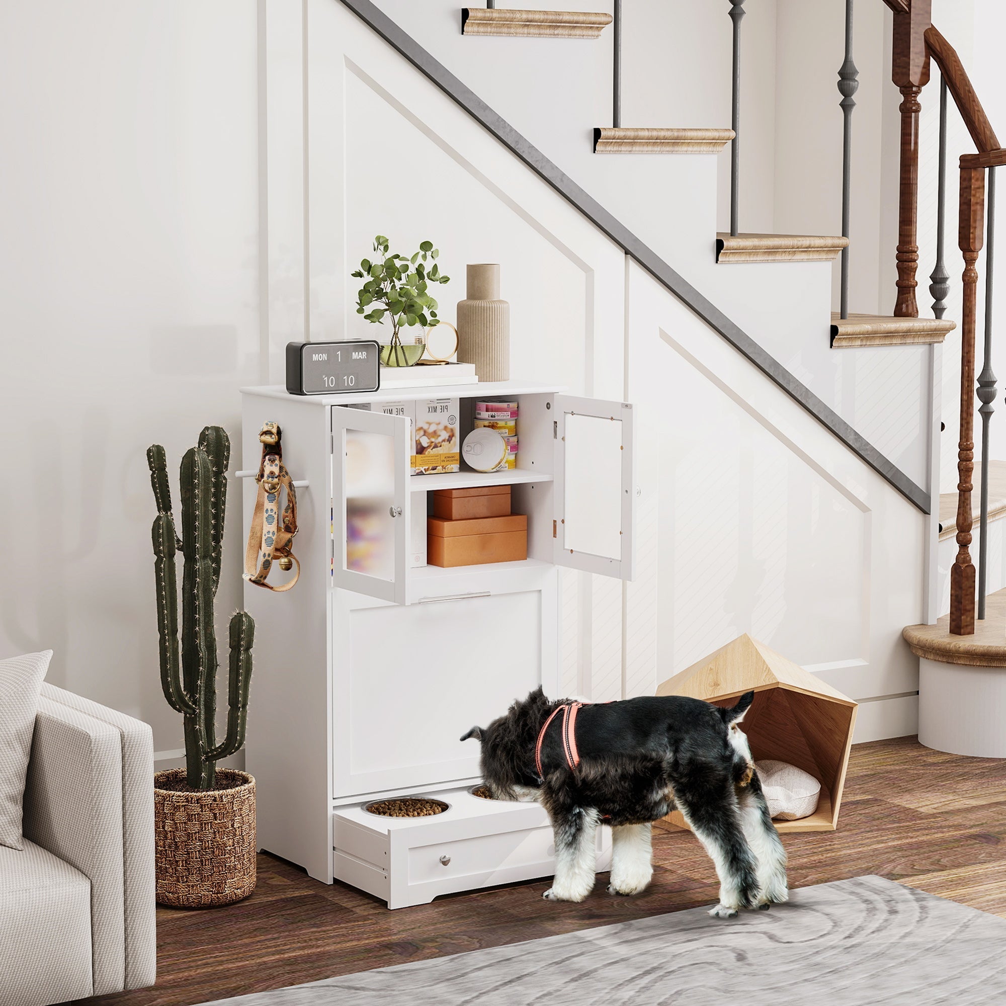 White under-stair pet feeder with glass-paneled doors, stainless steel bowl rack, upper cabinet, and pull-out drawer