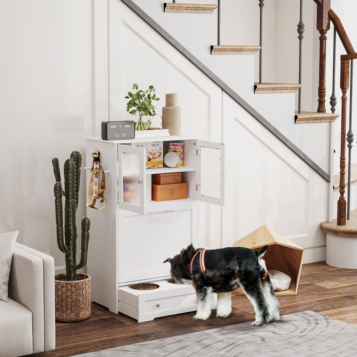 White under-stair pet feeder with glass-paneled doors, stainless steel bowl rack, upper cabinet, and pull-out drawer