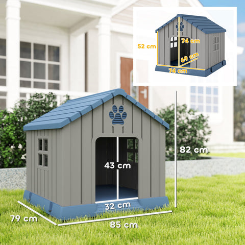 Gray and blue waterproof plastic dog house with slanted roof and paw print design for outdoor dog use