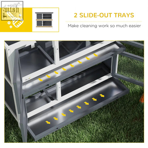Gray metal pawhut double decker rabbit hutch with two slide-out trays and four lockable doors for easy cleaning