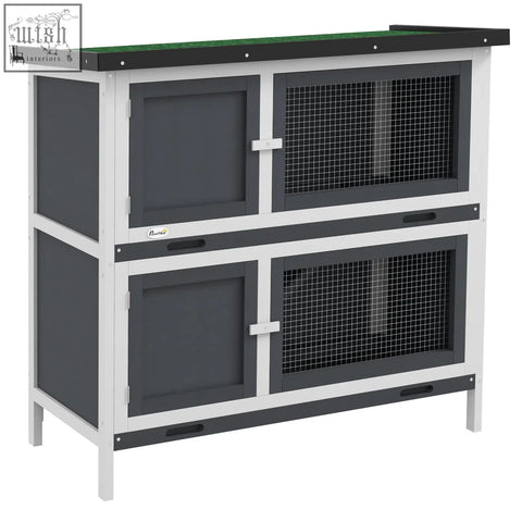 Two-tiered gray pawhut rabbit hutch with fir wood frame, wire mesh, four lockable doors, and two slide-out trays