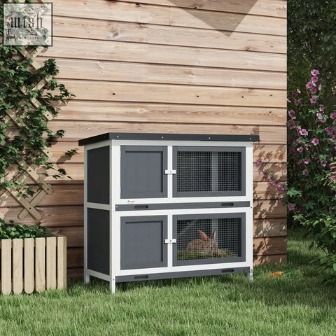 Two-tiered grey and white pawhut double decker rabbit hutch with fir wood, wire mesh, four lockable doors, and two slide-out trays