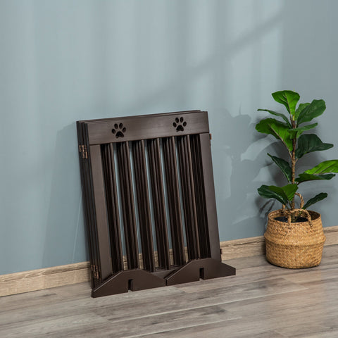 Dark brown pine wood pet gate with paw print cutouts foldable design for doorway stairs up to 204cm long