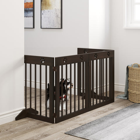 Dark brown pine wood pet gate with paw print cutouts and hinged design for freestanding safety fence use