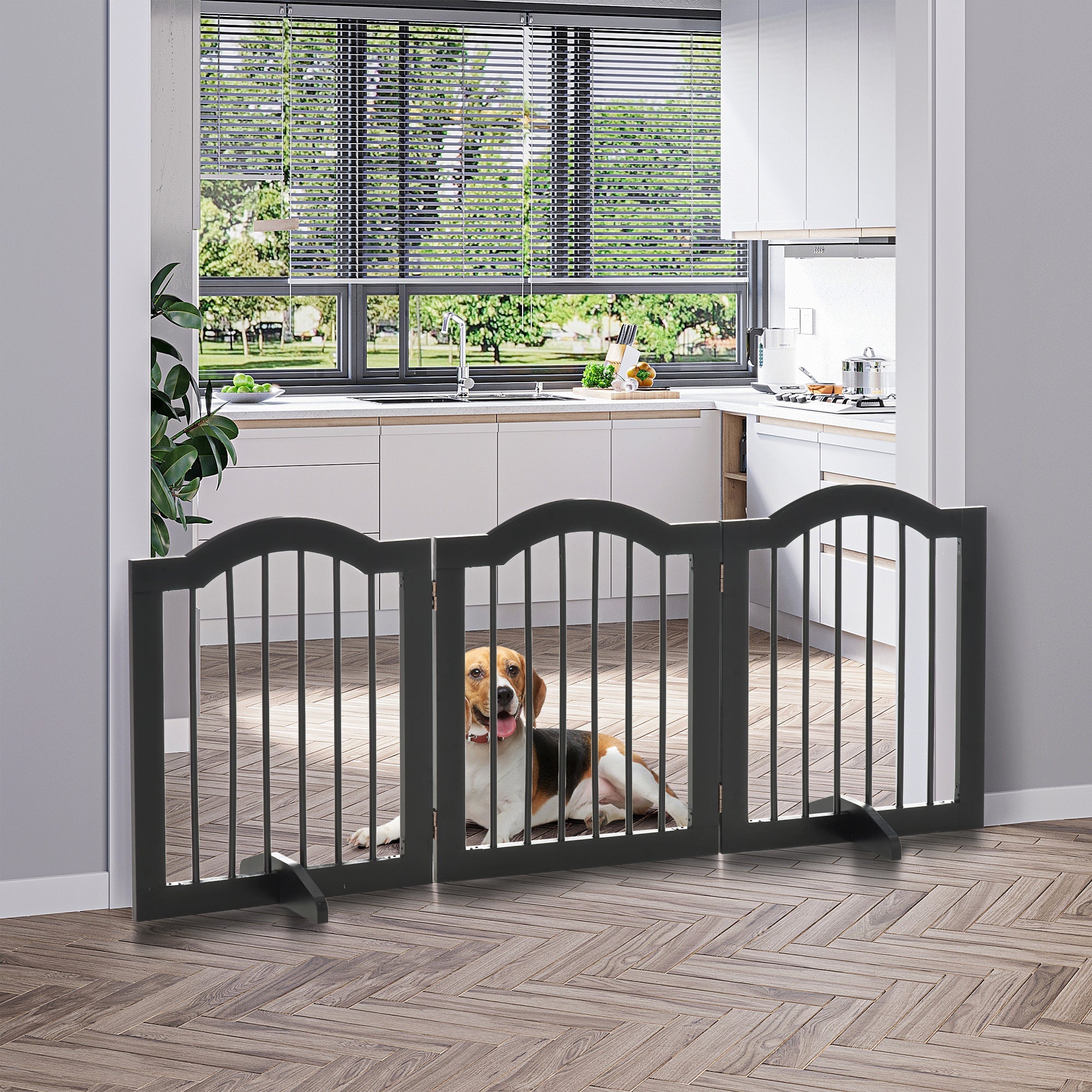 Black wooden dog gate with vertical slats sturdy hinges and support feet for safety barrier at doorways or stairs