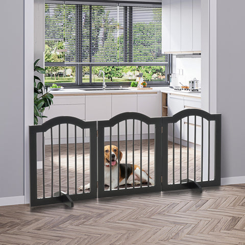 Black wooden dog gate with vertical slats sturdy hinges and support feet for safety barrier at doorways or stairs