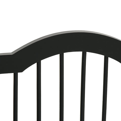 Black wooden dog gate with arched headboard vertical slats sturdy hinges and support feet for indoor safety barrier