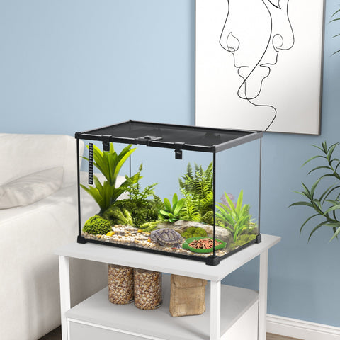 Black-framed glass reptile box terrarium with strip patch thermometer and substrate heater for turtles and lizards