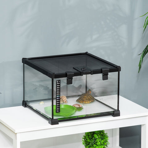 Black-framed pawhut glass reptile box with strip patch thermometer housing turtle and snails on substrate heater