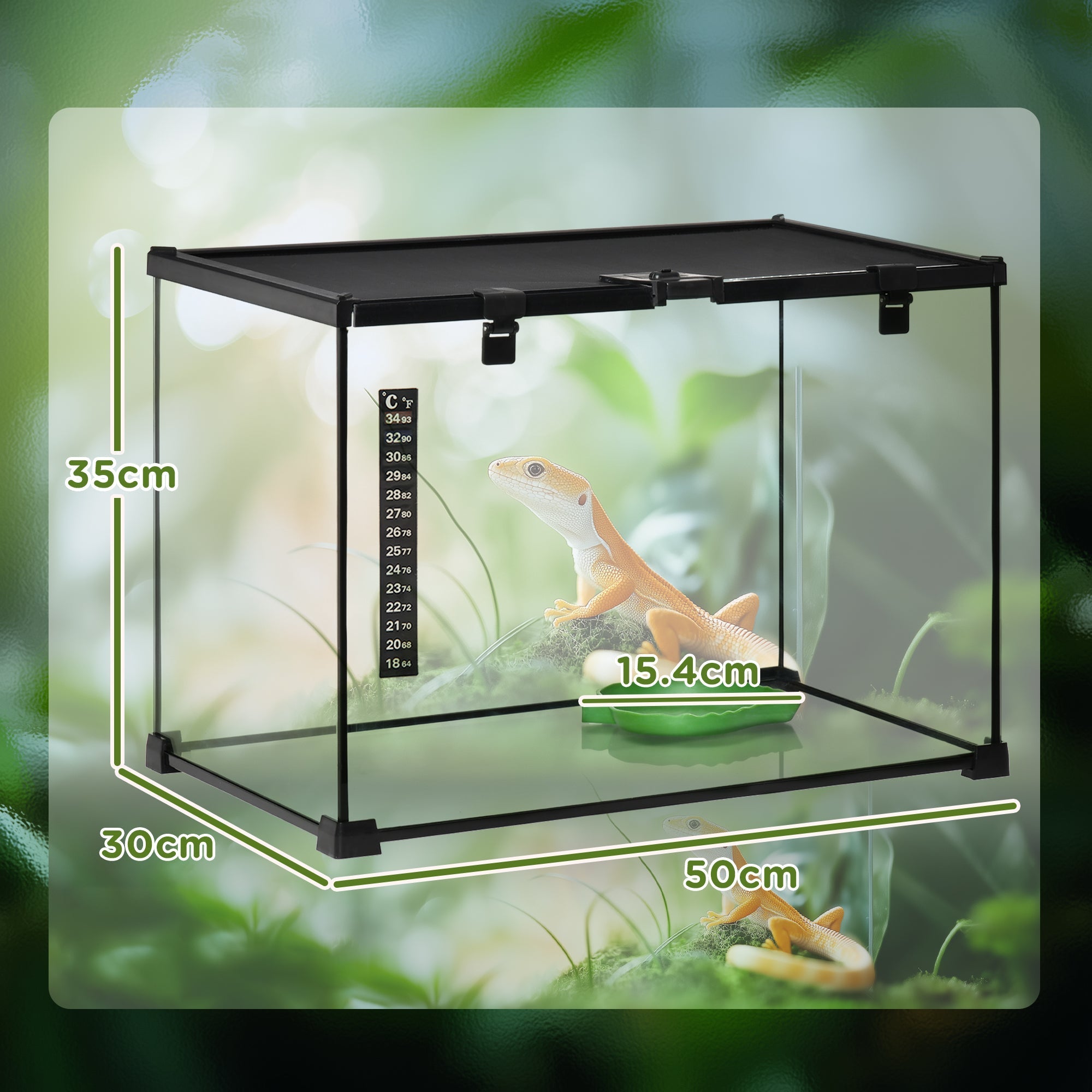 Black-framed glass reptile box with strip patch thermometer and gecko inside for lizards and substrate heater use