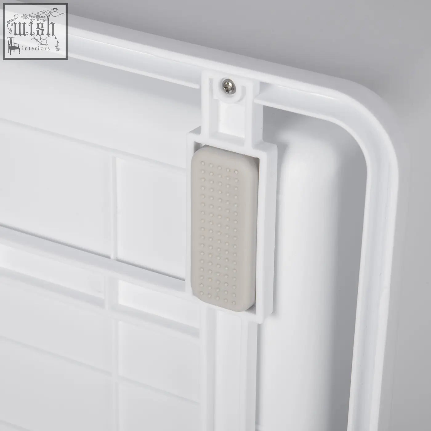 White plastic door stop with textured gray rubber insert for pawhut green cat litter box with high edges