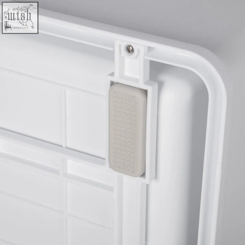 White plastic door stop with textured gray rubber insert for pawhut green cat litter box with high edges