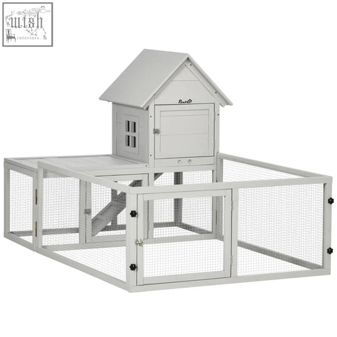 Gray wooden pawhut rabbit hutch with steel wire lockable doors and slide out tray for indoor use