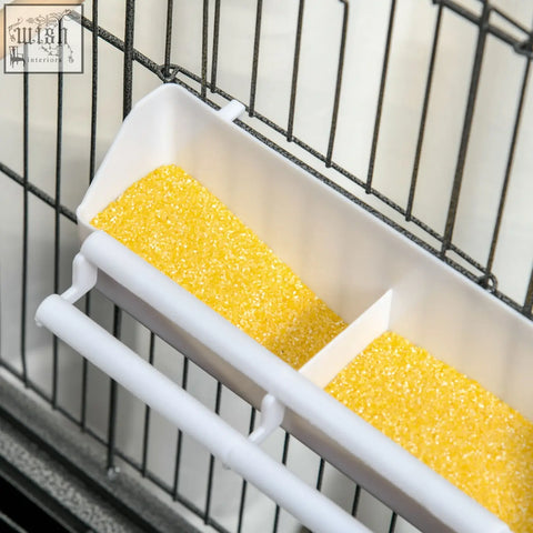 White plastic bird feeder with food containers filled with yellow corn for pawhut large bird cage with wooden perches