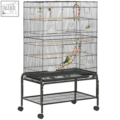 Black metal bird cage with wooden perches colorful toys on matching stand with wheels 79l x 49w for small birds