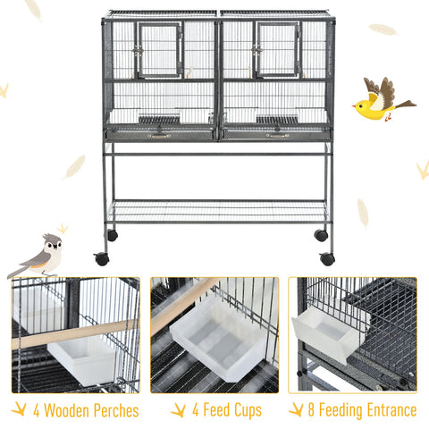 Black metal bird cage with two compartments, each door and plastic food containers plus slide-out metal trays included