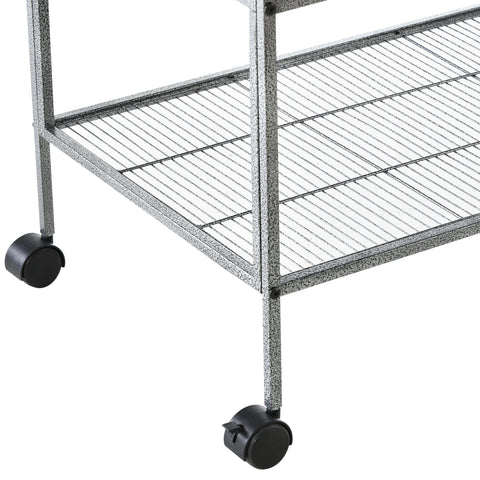 Gray speckled metal bird cage with slide-out metal trays and plastic food containers on black caster wheels for parrots