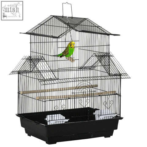 Black metal pawhut bird cage with plastic food containers and a green yellow parakeet for feathered friends