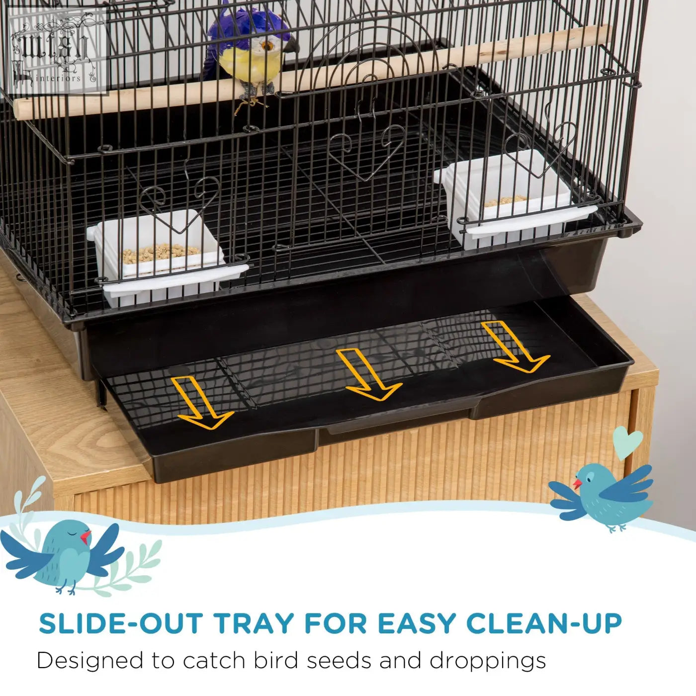 Black metal bird cage with heart-shaped bars and slide-out tray with plastic food containers for feathered friends