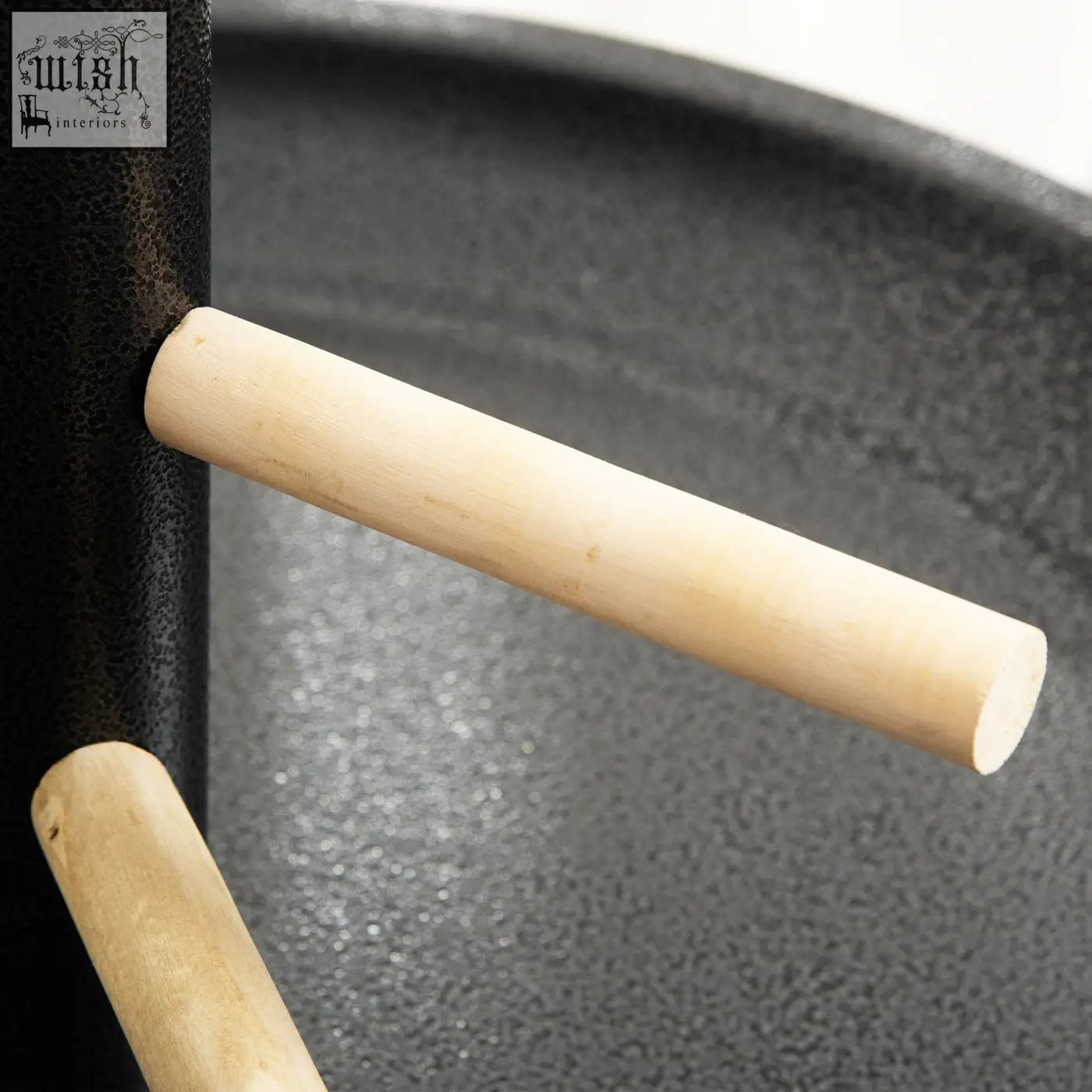 Light-colored wooden dowel rod part of pawhut metal bird table play stand with round tray and two stainless steel bowls