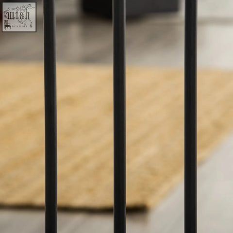 Black metal vertical bars of pawhut pet gate with cat door for safely blocking staircases and doorways