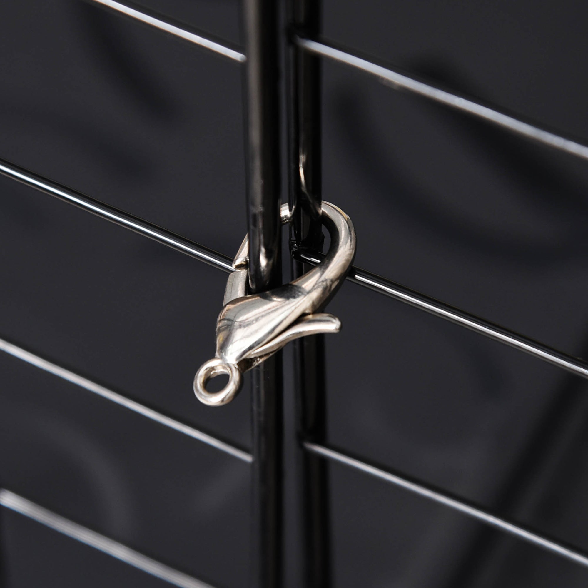 Silver dolphin-shaped lobster clasp used with pawhut pet playpen metal wire fence featuring three large doors and corner connectors