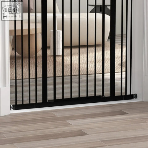 Black metal baby gate with vertical bars and sleek design featuring double locking mechanism for safety gate use