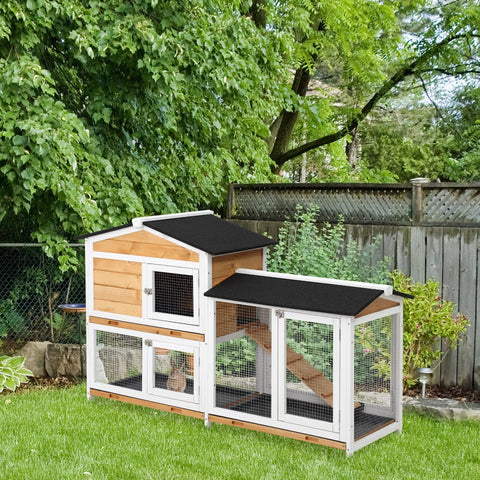 Two tier wooden rabbit hutch with white trim black roof panels and run box for outdoor living house use