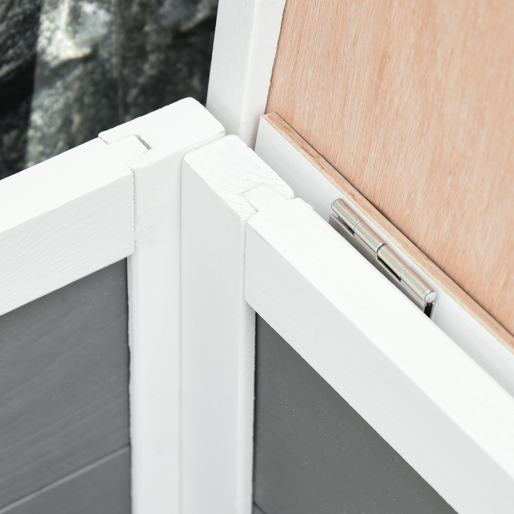White framed window with silver hinge on sturdy wooden frame structure of pawhut guinea pig hutch with light wood paneling