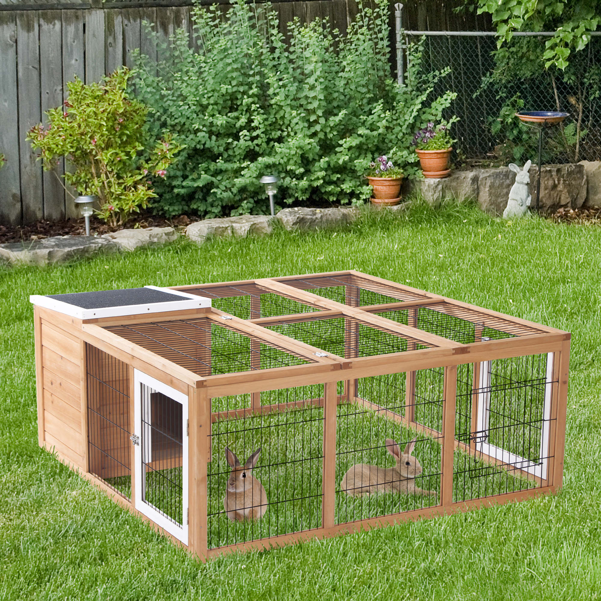 A pawhut rabbit hutch made of wood with a black roof white-trimmed door and wire mesh panels for outdoor use