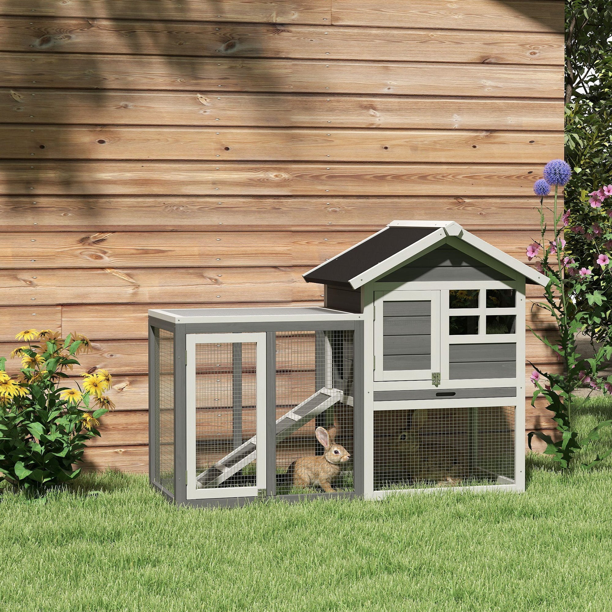 Gray and black pawhut rabbit hutch made of fir wood with wire mesh panels roof overhang and attached ramp