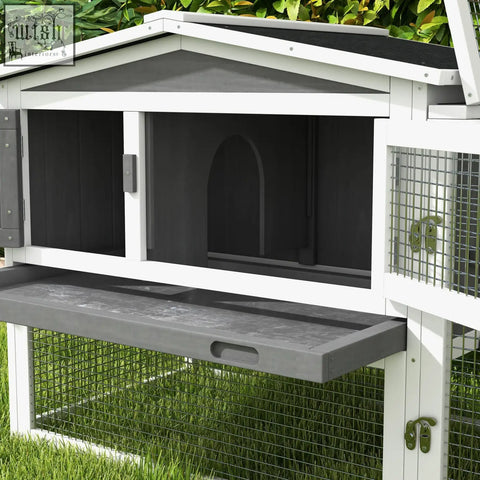 White and gray wooden pawhut rabbit hutch with asphalt roof, wire mesh sides, main house, ramp, and feeding tray