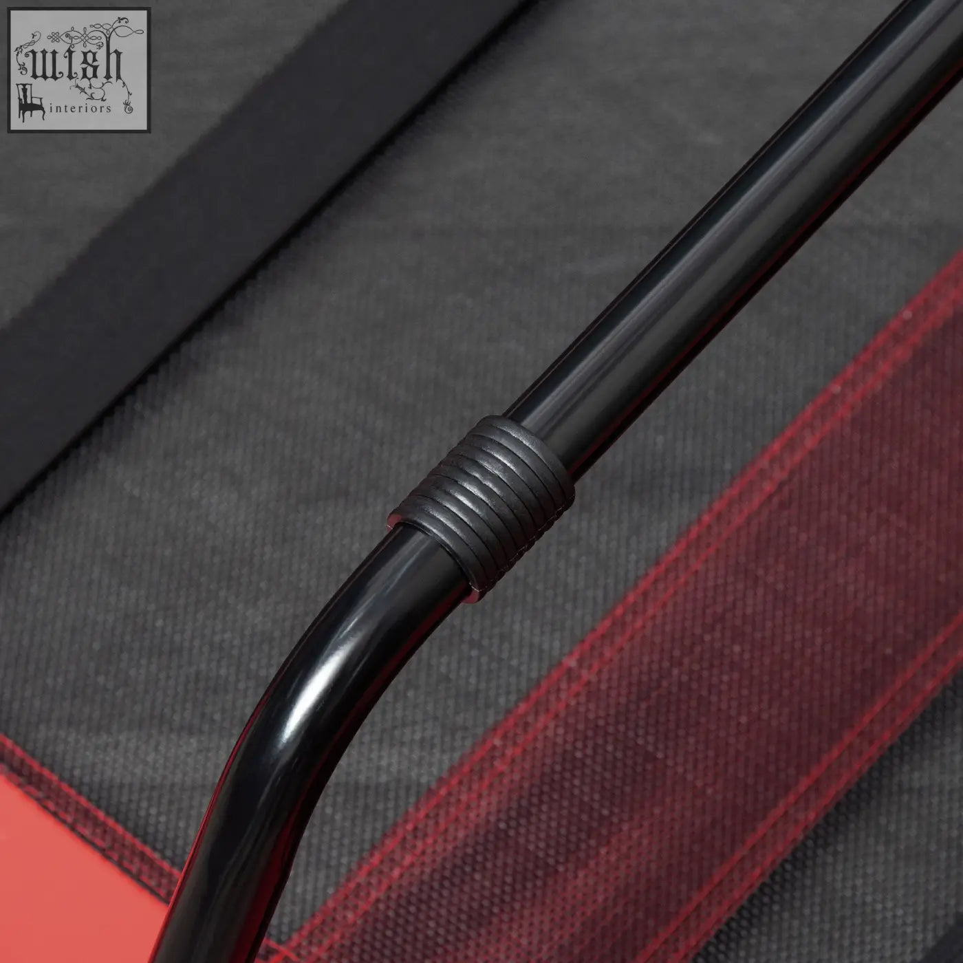 Black curved metal rod with ribbed grip on pawhut red raised dog bed that lets air flow for indoor outdoor use