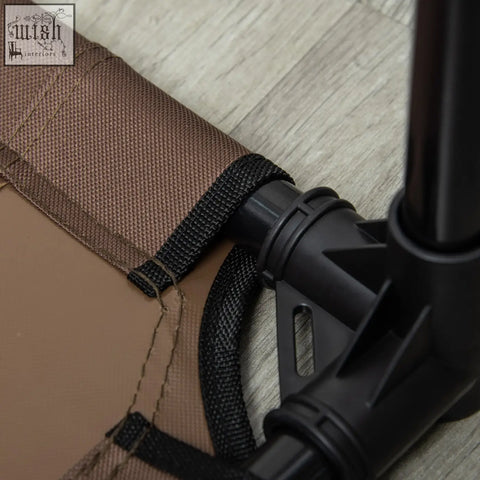Brown fabric with black webbing straps and plastic connector on pawhut elevated dog bed for large dogs