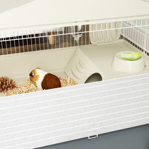 Beige pawhut small animal cage with white plastic habitat, small house, feeding bowl, and hay feeder for guinea pigs