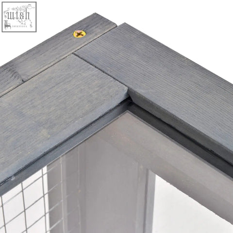 Gray wooden frame with subtle grain and yellow screw corner of pawhut tortoise house for small reptiles