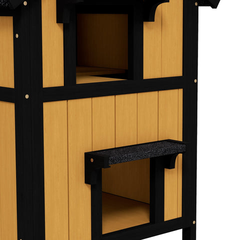 Black and tan wooden pawhut cat house with flower box and speckled black entryway ledge for outdoor use