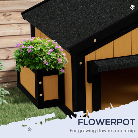Pawhut wooden cat house in black and tan with a yellow textured roof and purple flowers in the flower box