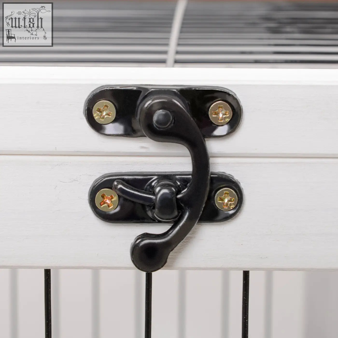 Black metal hasp with gold screws on white fir wood securing pawhut wooden guinea pig hutch with enclosed run area