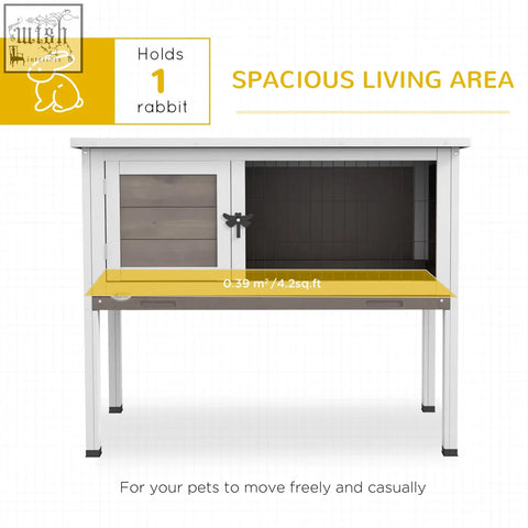 White metal-framed rabbit hutch with yellow work surface and glass door for small animals with asphalt roof