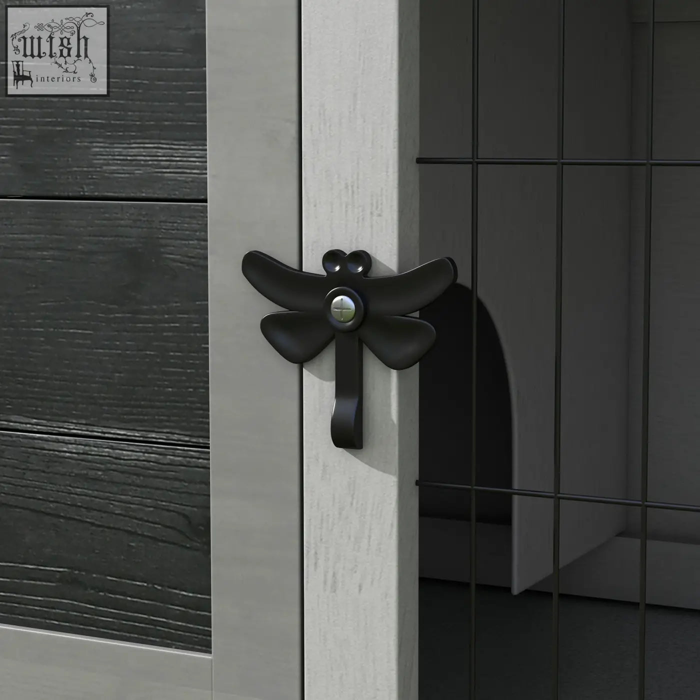 Black dragonfly-shaped matte cabinet pull with metallic screw center on pawhut wooden guinea pig hutch with asphalt roof