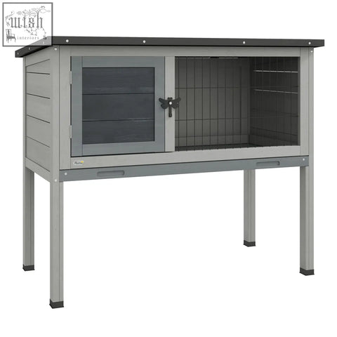 Gray metal guinea pig hutch with glass door, wire mesh side, black butterfly latch, and small asphalt roof