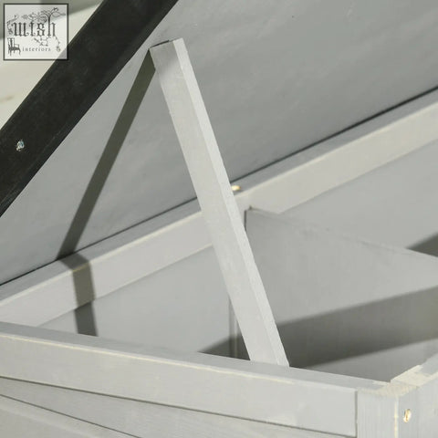 White painted wooden support beam with black diagonal brace on the back of pawhut guinea pig hutch with asphalt roof