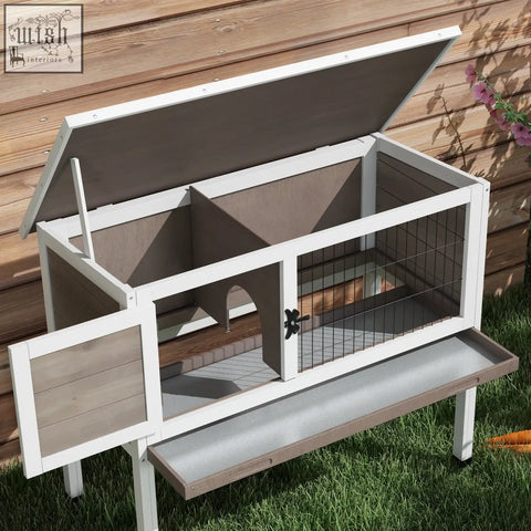Pawhut wooden guinea pig hutch with white and gray wood, wire mesh sides, asphalt roof, and attached feeding tray for small animals
