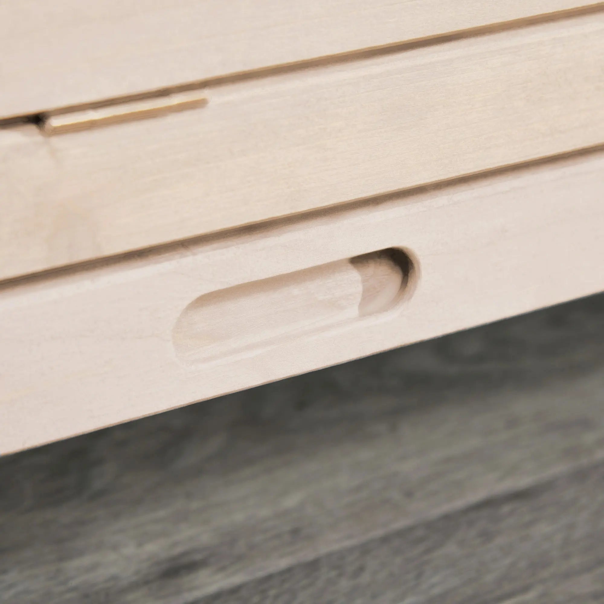 Light wooden drawer with recessed handle and subtle grain in pawhut hamster cage with two huts and two openings